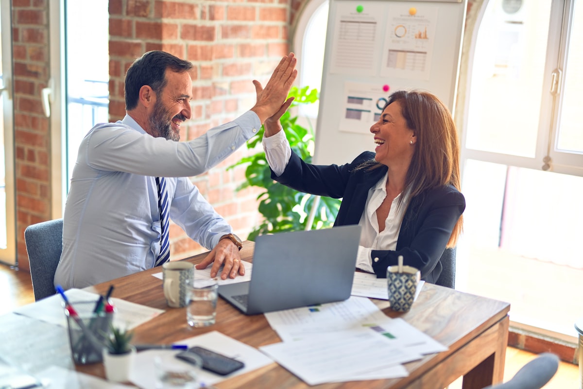 Team collaborating in a modern office — your existing team can manage billing in-house with the right tools
